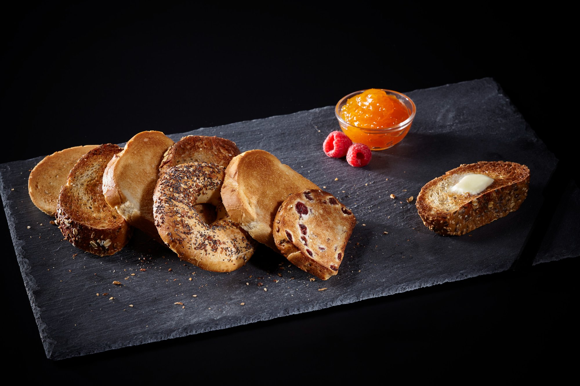 Dark moody food photography — toast on slate surface, Reveal Photo